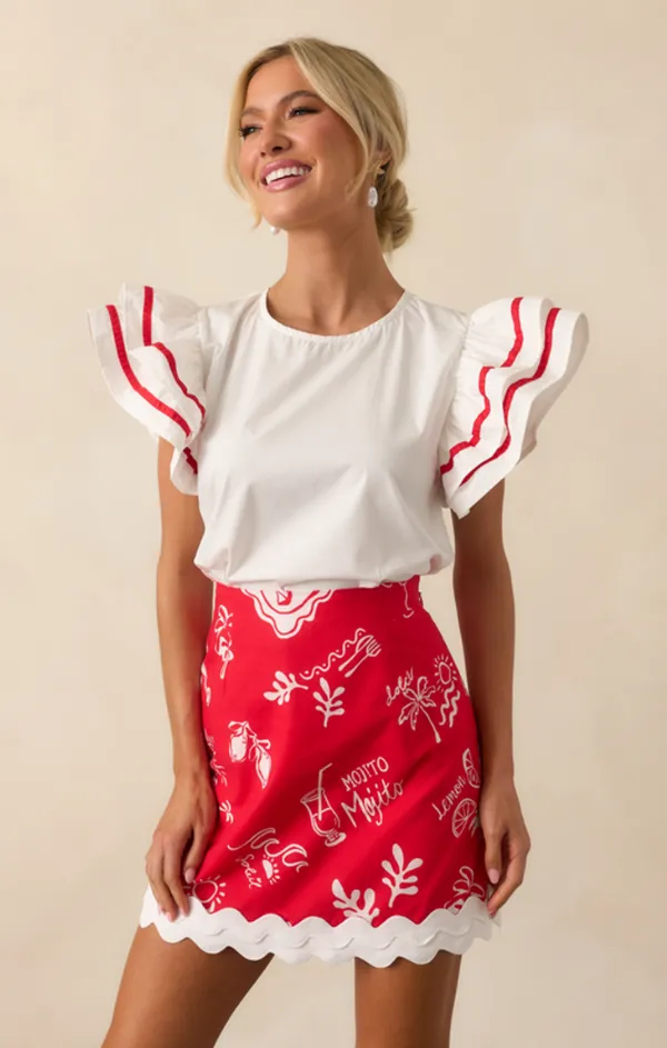 Eva Ruffle Top Global Glow